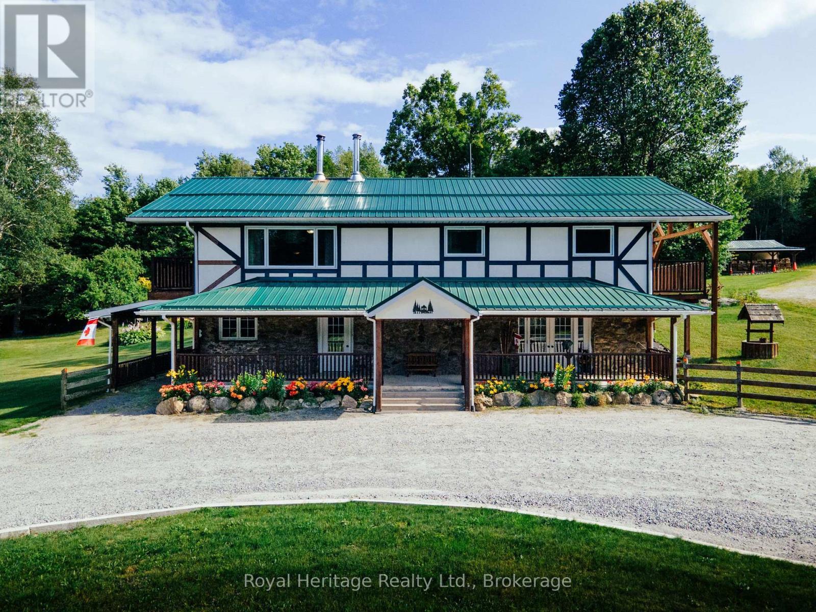 Escape to your own private retreat on 141 acres of managed forest, complete with many established trails and continue across Crown land to beautiful Salmon Trout Lake. Whether you enjoy hiking, ATVing, hunting, farming, homesteading, exploring nature, or simply the peace and privacy of country living, this property offers an exceptional outdoor lifestyle with the added benefit of a mature forest and a Managed Forest Tax Incentive.The well-maintained 3 bedroom, 3 bathroom home has been thoughtfully designed for comfortable everyday living. The spacious primary suite features a private 3-piece ensuite and walkout to a balcony overlooking the surrounding forest. A bright sunroom with sliding doors provides the perfect place to enjoy your morning coffee or unwind at the end of the day.The finished basement includes a sound-insulated media room, creating an ideal space for movie nights, gaming, or entertaining. The home is equipped with central air conditioning, a gas range, stainless steel appliances, a relaxing jetted tub, drilled well plus a second dug well for gardens and landscaping.Outside, the property continues to impress. A large 6 car 50' x 30' Quonset garage with 16' x 10' door and 240V/50-amp service is ready for electric vehicle charging, welding, or workshop projects. An additional heated 15' x 40' workshop with 8' door, with hydro offers even more flexibility for hobbies or a home-based business. Also a car port at the side of the house. You'll also find a greenhouse, raised garden beds, storage shed, carport, and a circular driveway providing easy access and ample parking. With endless trails, exceptional privacy, quality outbuildings, and room to live, work, and explore, this unique property offers a rare opportunity to own a true recreational and country estate with farming possibilities. You won't be disappointed! (id:48254)
