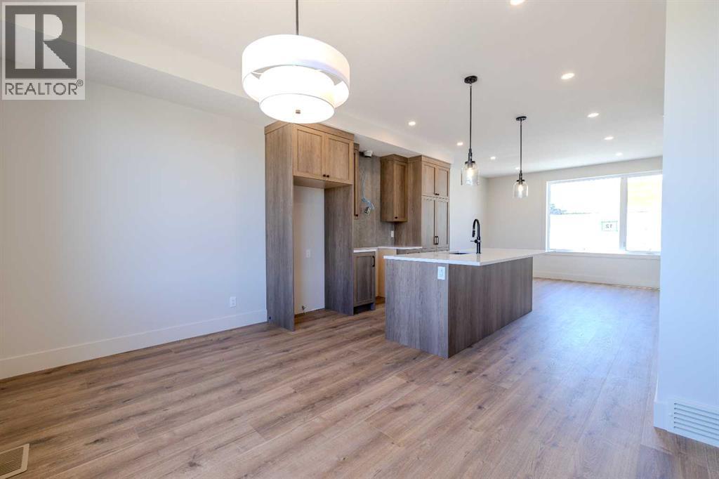 12 Tillotson Downs, Okotoks, Alberta  T1S 4Z5 - Photo 6 - A2292428