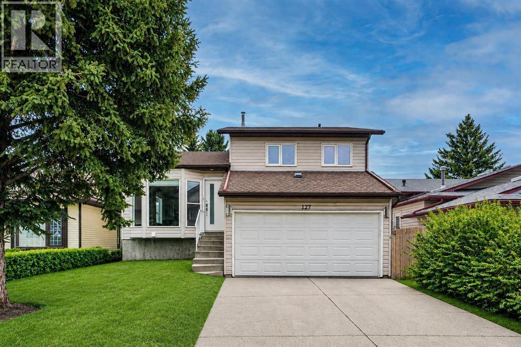 127 Woodstock Road SW, Calgary, Alberta  T2W 5W3 - Photo 1 - A2313153