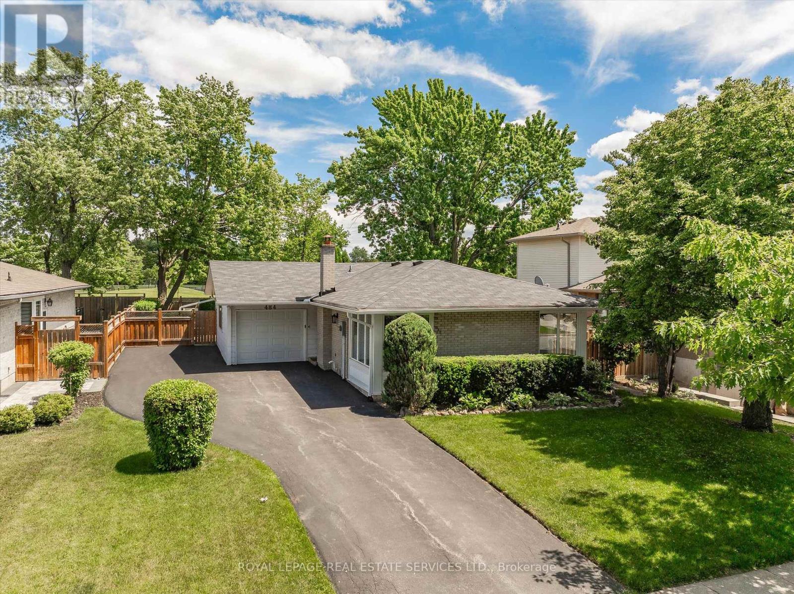 PREMIUM 125' DEEP LOT BACKING ONTO HOLTON HEIGHTS PARK OFFERING INCREDIBLE PRIVACY! ORIGINAL OWNERS! Welcome to 484 Grand Boulevard, a charming 3+1 bedroom bungalow nestled in the desirable Falgarwood community and backing directly onto Holton Heights Park. Situated on an impressive 60' x 125' mature lot, this well-cared-for home presents an exceptional opportunity to renovate, personalize, or reimagine your dream home in a well-established Oakville neighbourhood. The bright main level features spacious living and dining rooms highlighted by beautiful 90-degree corner windows that fill the space with natural light. The eat-in kitchen offers a convenient side yard walkout, while three bedrooms and a four-piece bathroom complete this level. One bedroom enjoys direct access to the backyard through a sliding door walkout to the deck. The finished basement adds valuable living space with a recreation room with electric fireplace, dining area, fourth bedroom, two-piece bathroom, laundry room, and abundant storage space. Additional highlights include updated windows, roof, downspouts, an owned hot water heater, and new carpet with original hardwood flooring underneath. Step outside to discover the property's standout feature - a private park-like backyard oasis backing onto greenspace with no rear neighbours. Mature trees, manicured lawn, sculpted hedges, landscaped garden beds, a natural stone patio, custom deck, and garden shed create a peaceful outdoor retreat. Onsite parking accommodates up to six vehicles, with five spaces on the driveway and one in the attached garage. Ideally located close to parks, trails, schools, shopping, public transit, and major commuter routes, this is a rare opportunity to secure a premium lot in one of Oakville's most established and family-friendly neighbourhoods. (certain images have been virtually staged) (id:48254)