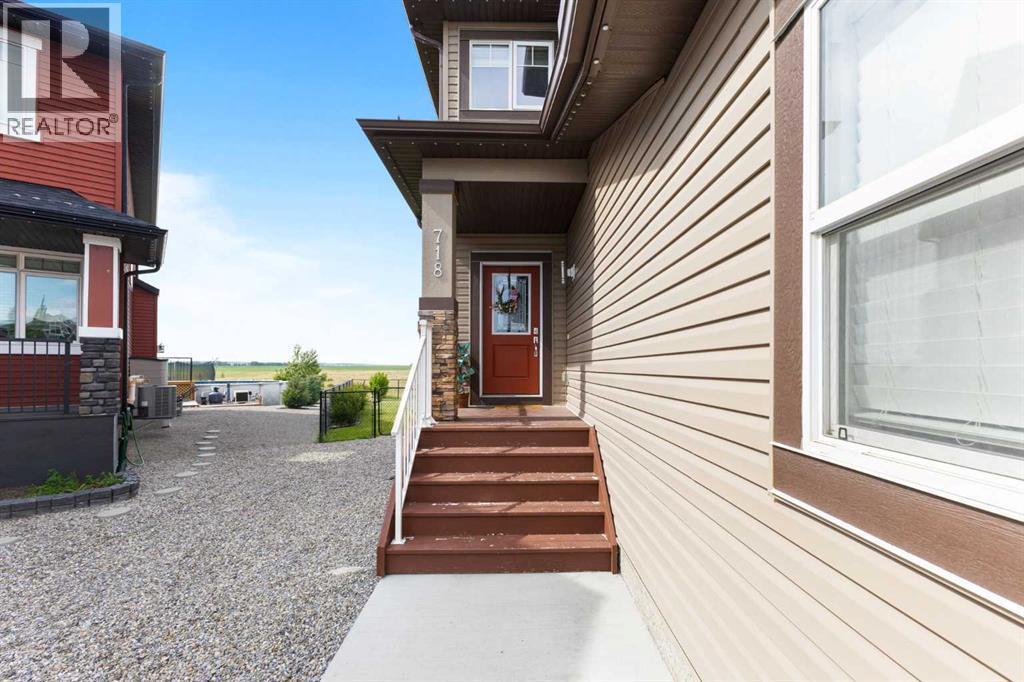 718 Hampshire Cove NE, High River, Alberta  T1V 0E6 - Photo 4 - A2331590