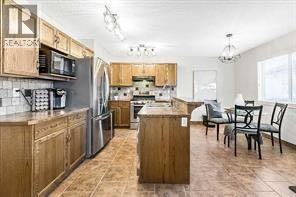 105 Cimarron Park Circle, Okotoks, Alberta  T1S 2H5 - Photo 7 - A2311097