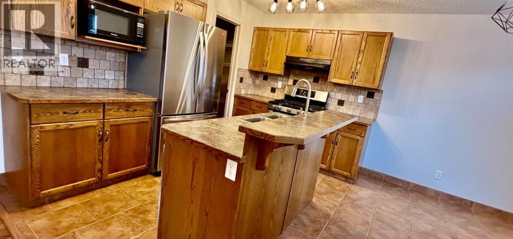 105 Cimarron Park Circle, Okotoks, Alberta  T1S 2H5 - Photo 6 - A2311097