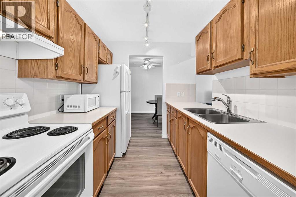 307, 309 Woodside Drive Nw, Airdrie, Alberta  T4B 2E7 - Photo 7 - A2330737