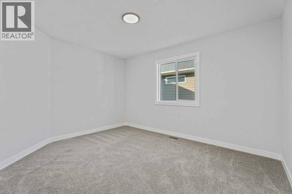 71 Ranchers View, Okotoks, Alberta  T1S 5R6 - Photo 35 - A2317784