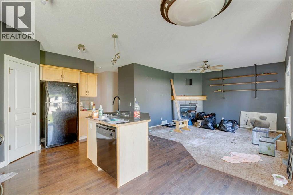 56 Crystal Shores Place, Okotoks, Alberta  T1S 2G3 - Photo 7 - A2306869