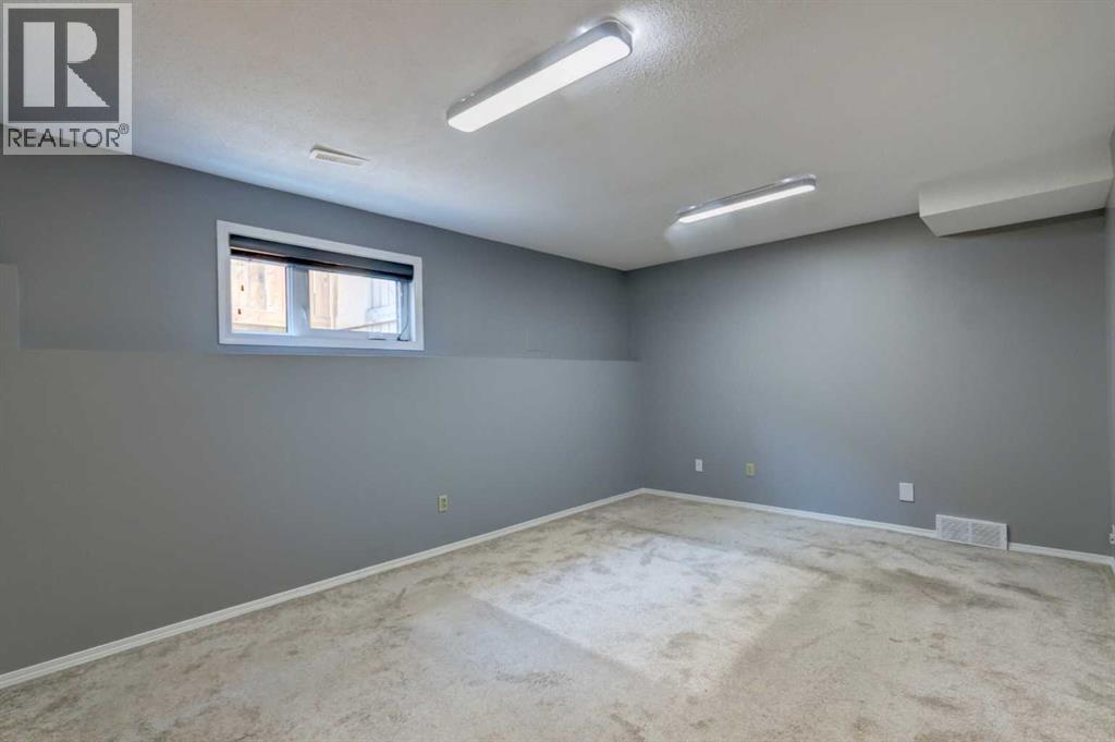 411 Shawinigan Drive SW, Calgary, Alberta  T2Y 3A2 - Photo 22 - A2330883