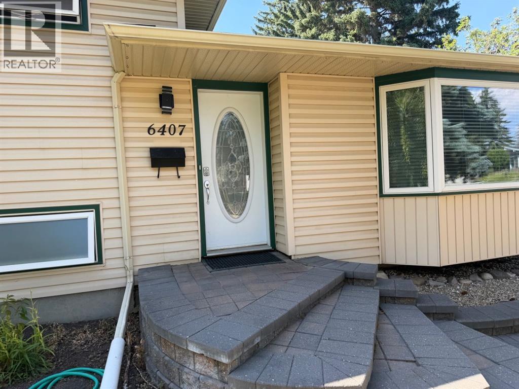 6407 Lombardy Crescent SW, Calgary, Alberta  T3E 5R3 - Photo 5 - A2332874