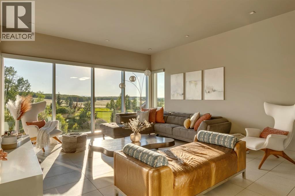 218 Grizzly Rise, Rural Rocky View County, Alberta  T4C 0B5 - Photo 6 - A2279006