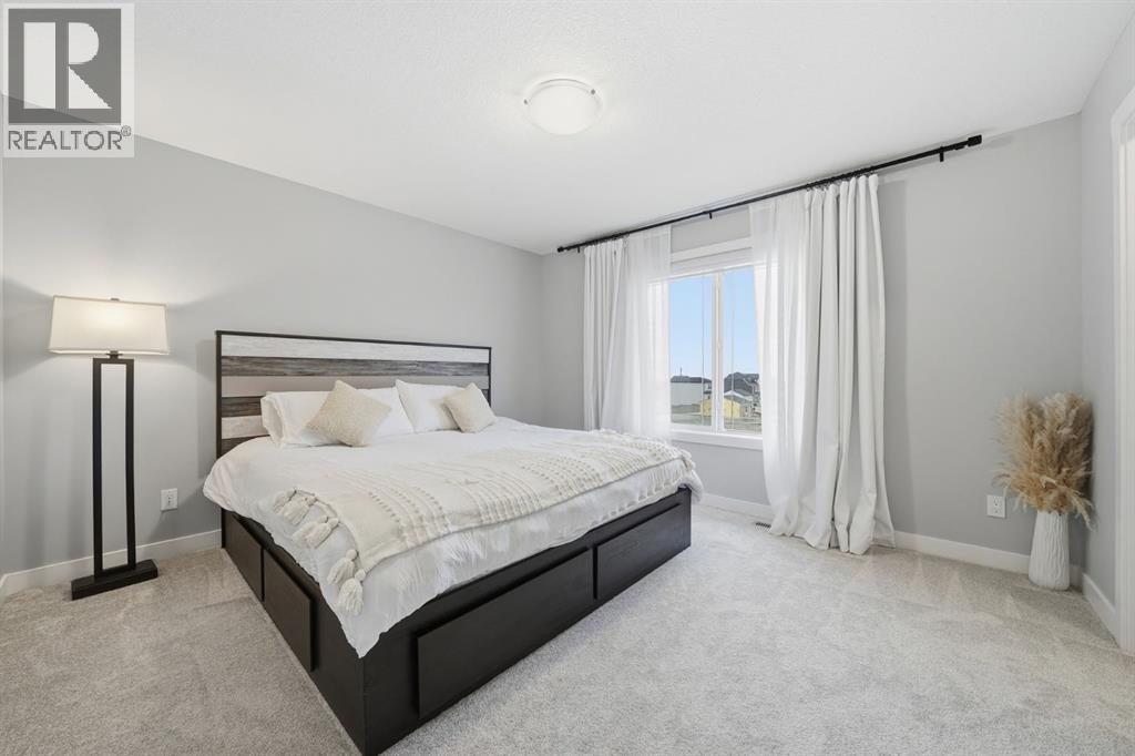 902 Bluerock Way SW, Calgary, Alberta  T2Y 0S5 - Photo 23 - A2332149
