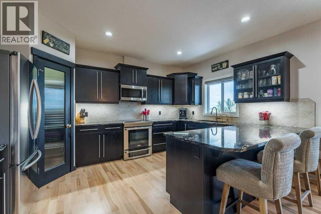 472 Sunset Link, Crossfield, Alberta  T0M 0S0 - Photo 9 - A2324153