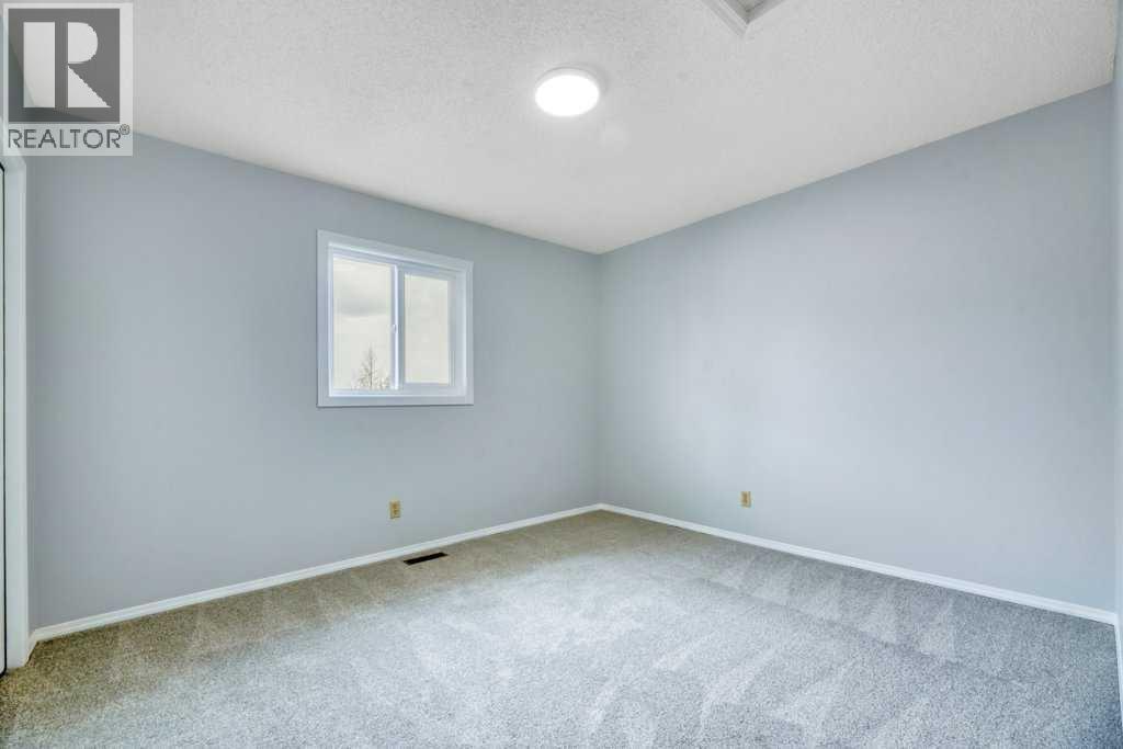 215 Hawktree Circle Nw, Calgary, Alberta  T3G 2Y6 - Photo 35 - A2305784