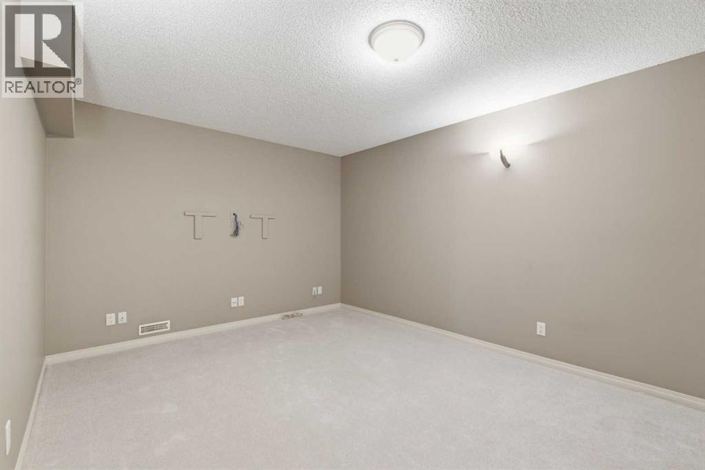 215 Rocky Ridge Villas NW, Calgary, Alberta  T3G 4R2 - Photo 35 - A2329725