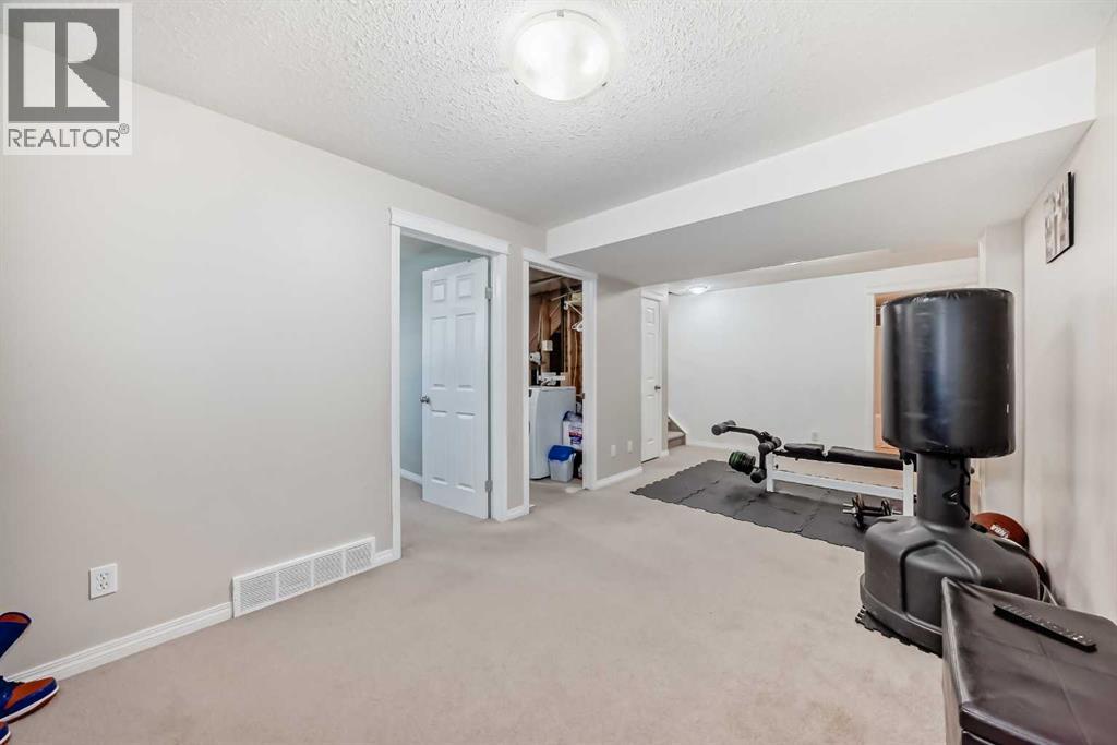 65 Spring Meadows Bay, Okotoks, Alberta  T1S 2G8 - Photo 35 - A2312954