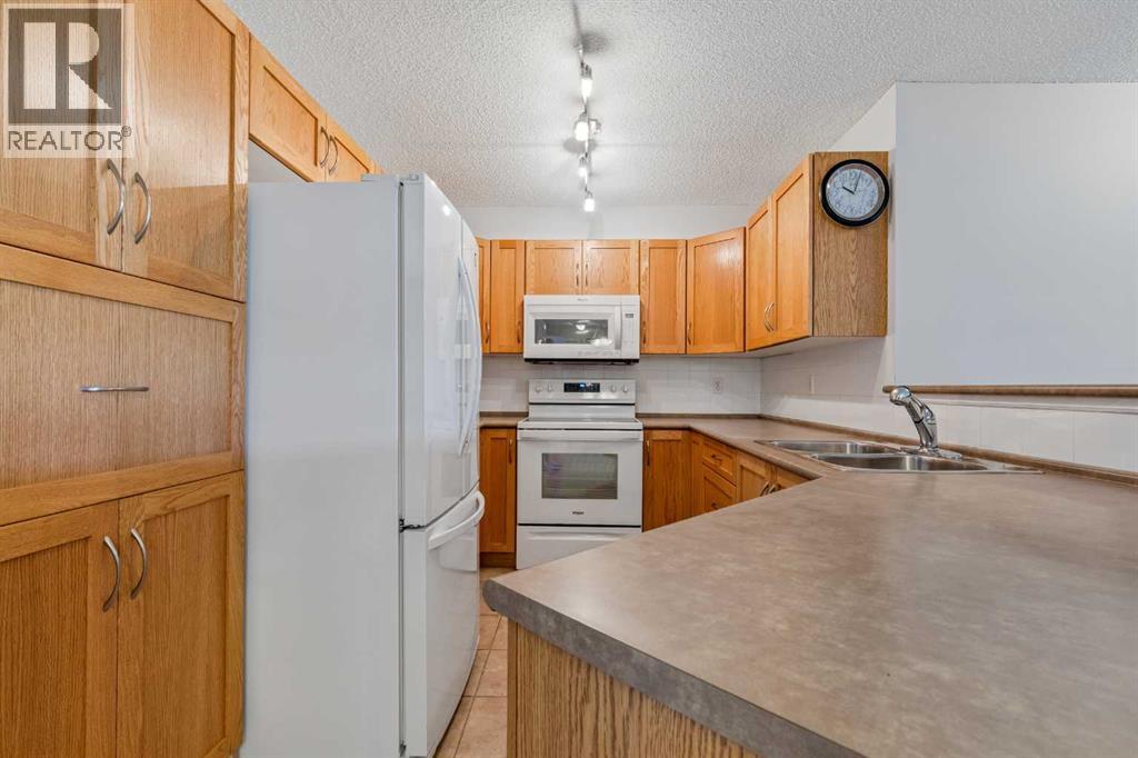 7207, 304 Mackenzie Way SW, Airdrie, Alberta T4B 3H7 - Photo 9 - A2330496