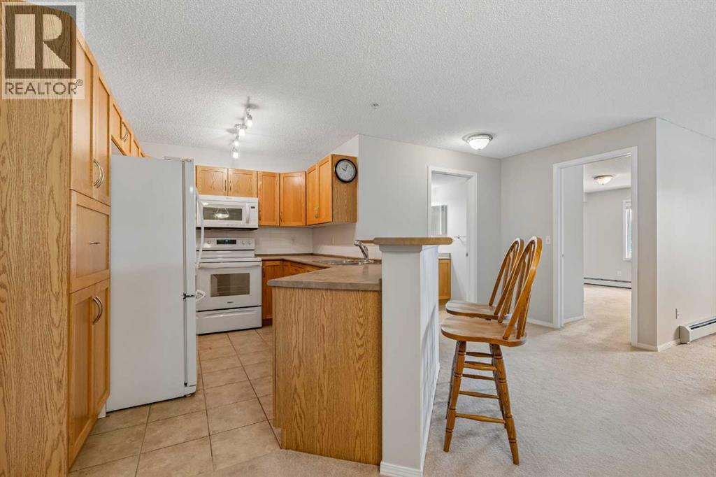 7207, 304 Mackenzie Way SW, Airdrie, Alberta T4B 3H7 - Photo 8 - A2330496