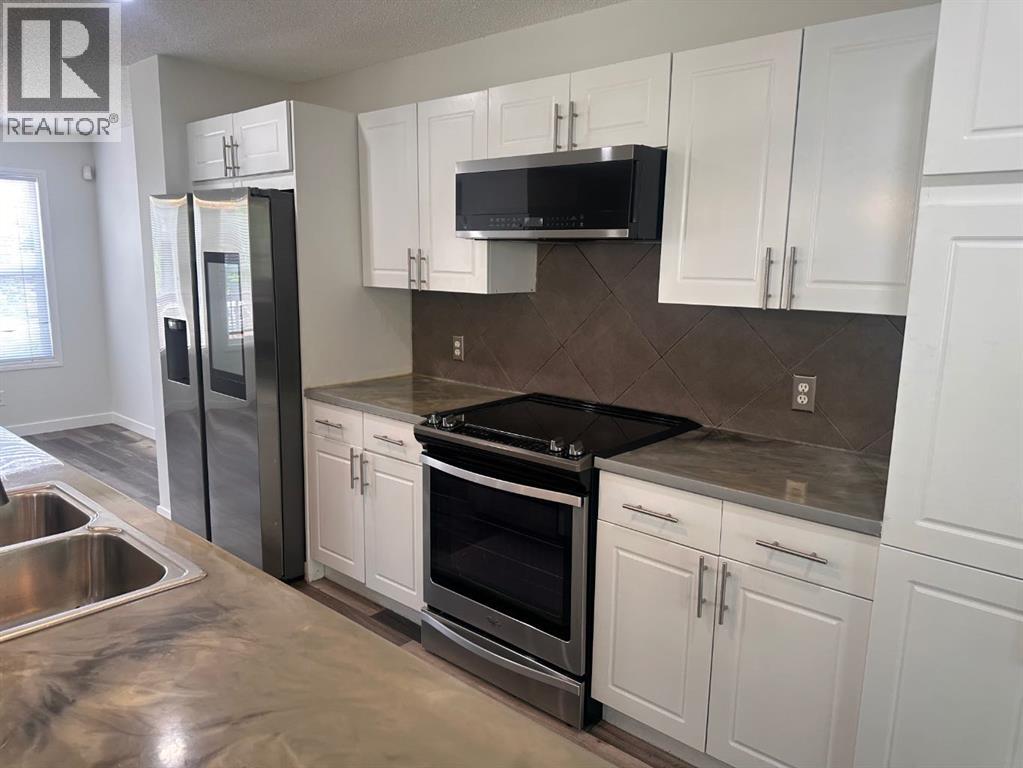 78 Crystal Shores Heights, Okotoks, Alberta  T1S 2K9 - Photo 8 - A2318337