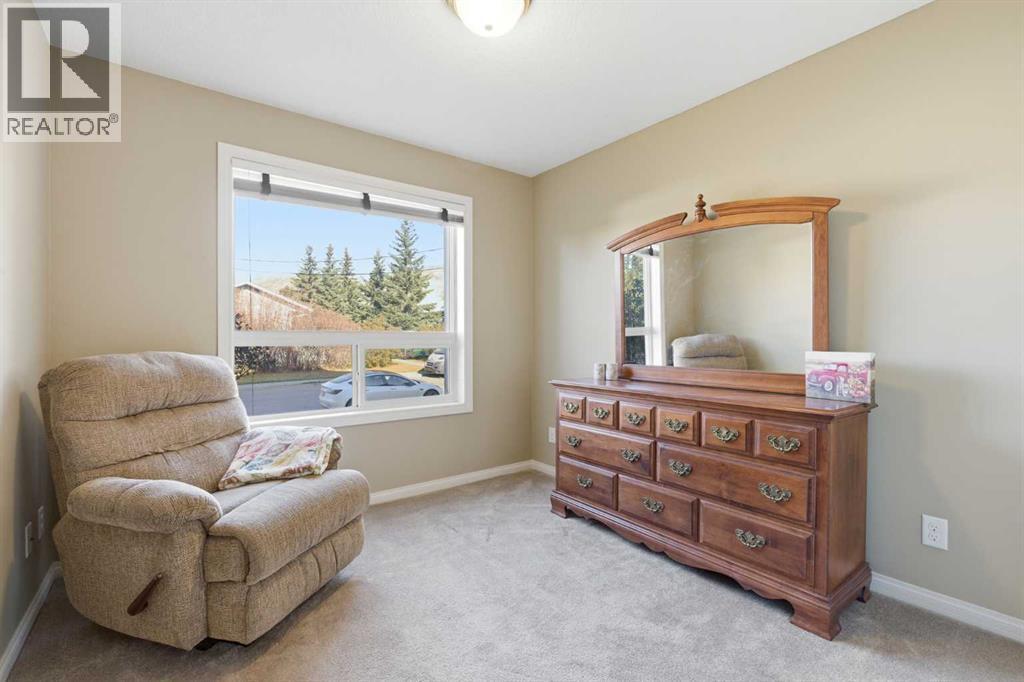 103, 128 Centre Avenue, Cochrane, Alberta T4C 2K5 - Photo 15 - A2332799