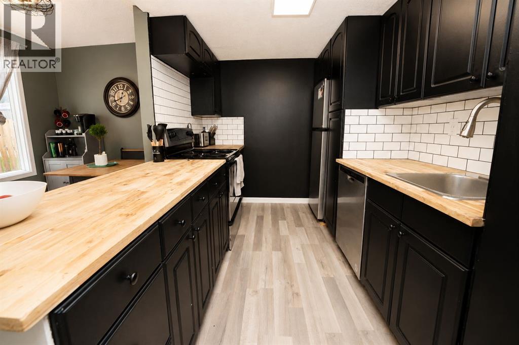 6527 Huntsbay Road NW, Calgary, Alberta  T2K 5R3 - Photo 11 - A2332141
