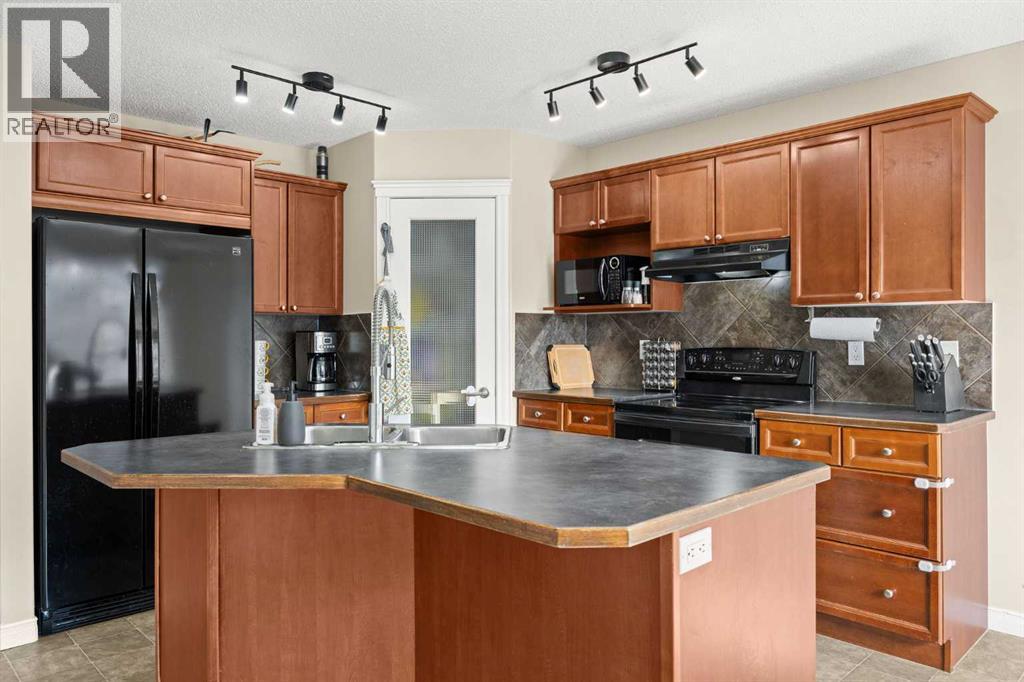 76 Crystal Shores Heights, Okotoks, Alberta  T1S 2K9 - Photo 12 - A2306208