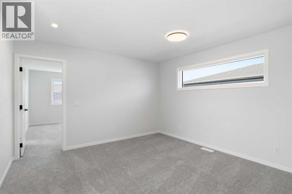 572 Belmont Heath SW, Calgary, Alberta  T2X 4H4 - Photo 15 - A2333478