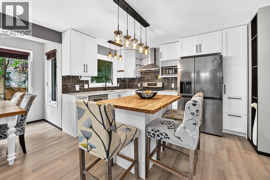 81 Sandalwood Court NW, Calgary, Alberta  T3K 4B7 - Photo 7 - A2331272