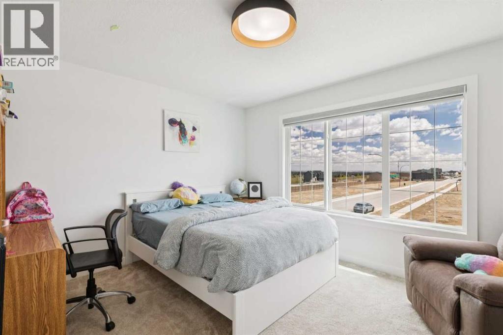 814 Bluerock Way SW, Calgary, Alberta  T2Y 0S4 - Photo 28 - A2313536