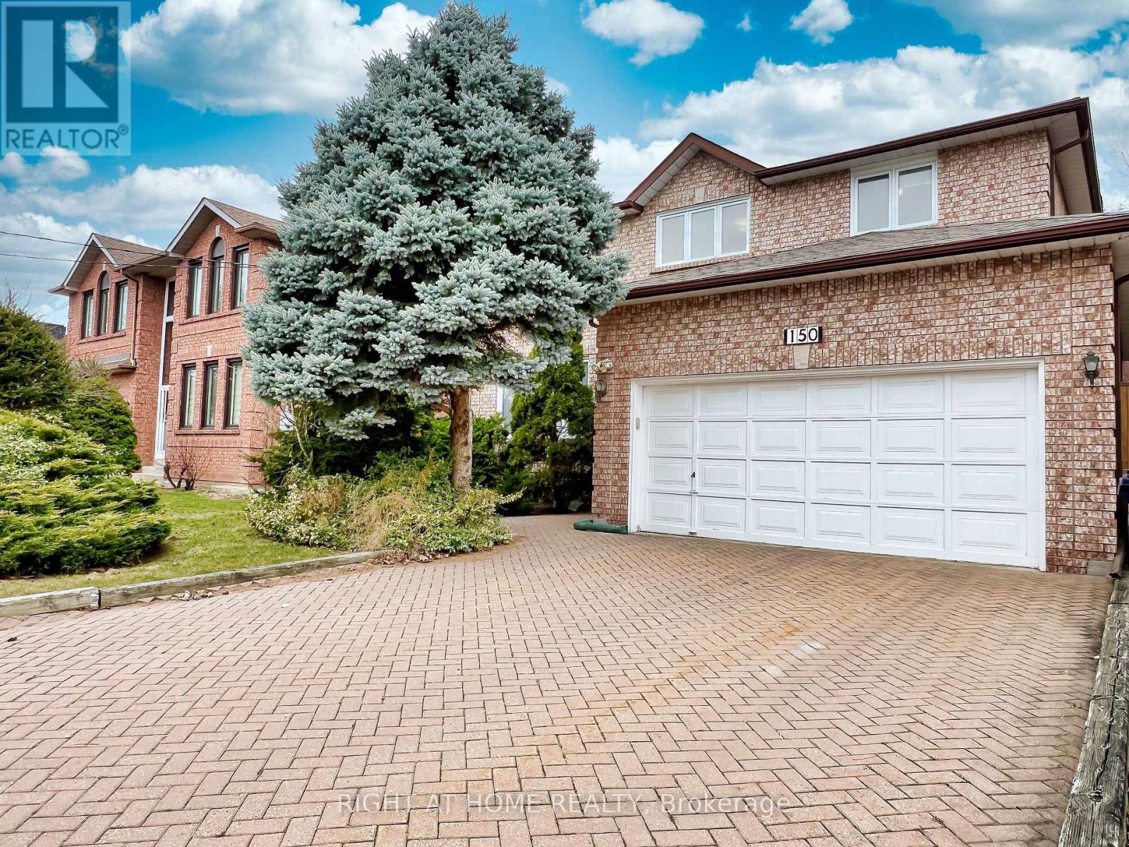 <div class="slider-price">$2,098,000</div><p>150 Holmes Avenue, Toronto, Ontario</p>