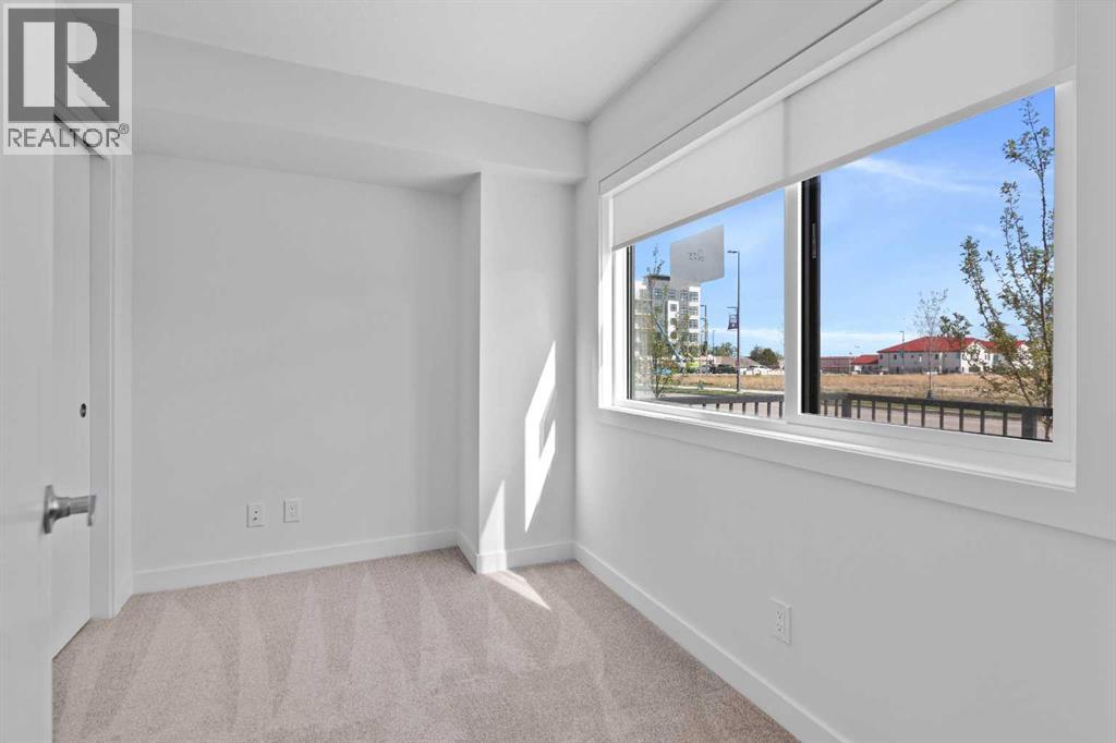 132 Quesnay Wood Link SW, Calgary, Alberta  T3E 8H6 - Photo 4 - A2319355