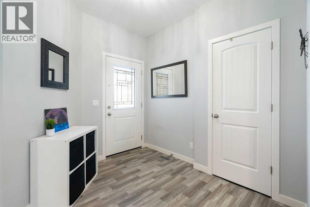 642 Kingsmere Way SE, Airdrie, Alberta  T4A 0x7 - Photo 3 - A2323083