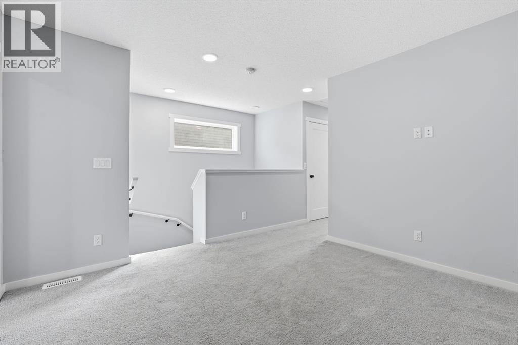 141 Belmont Drive SW, Calgary, Alberta  T2X 4Z7 - Photo 15 - A2330413