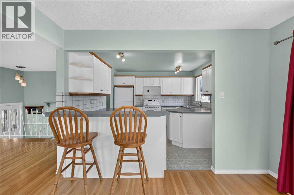 7727 Bowcliffe Crescent NW, Calgary, Alberta  T3B 2S6 - Photo 18 - A2328949
