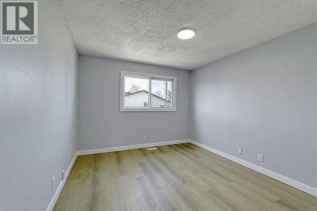 71 Falton Drive Ne, Calgary, Alberta  T3K 1K6 - Photo 21 - A2315489
