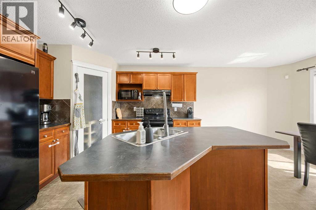 76 Crystal Shores Heights, Okotoks, Alberta  T1S 2K9 - Photo 10 - A2306208