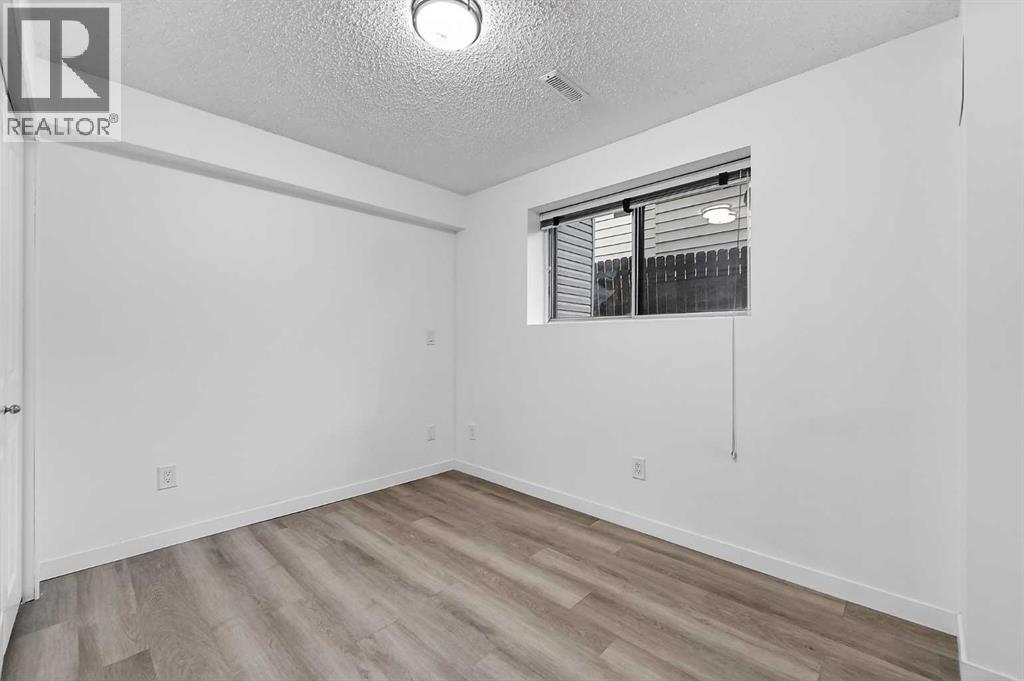 1091 Berkley Drive NW, Calgary, Alberta  T3K 1S6 - Photo 20 - A2329717