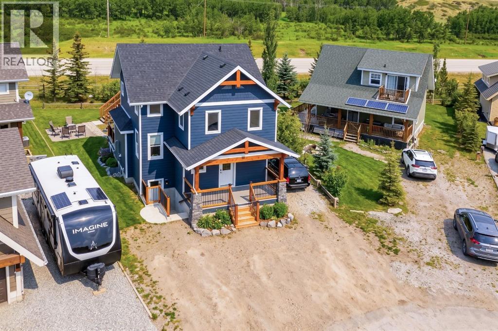 216 Cottageclub Crescent, Rural Rocky View County, Alberta  T4C 1B1 - Photo 2 - A2302814