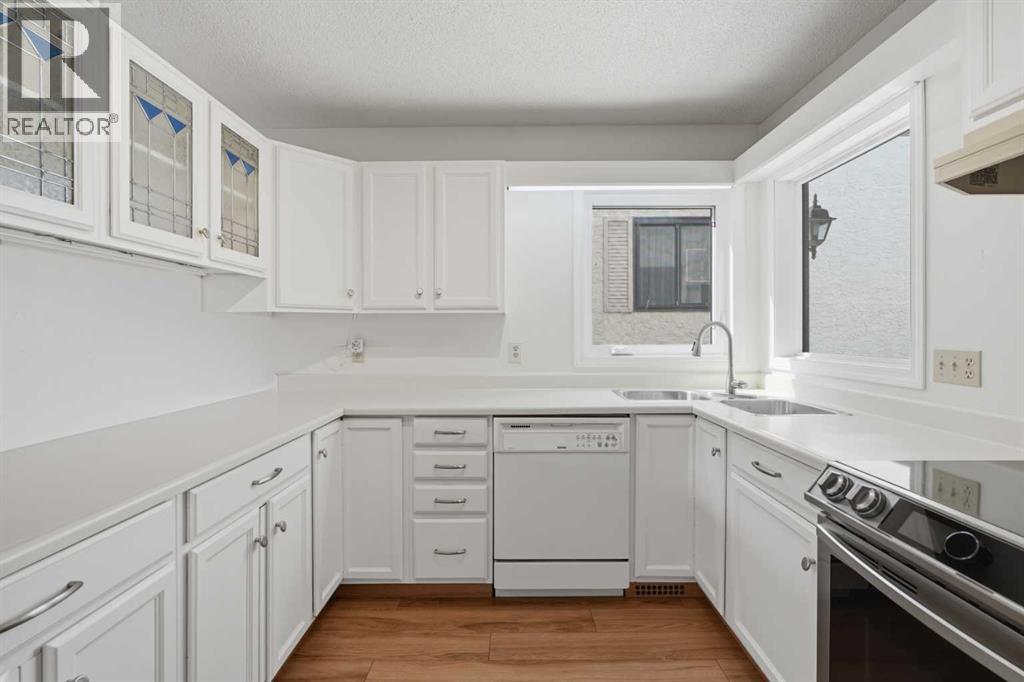 30 Sandarac Circle NW, Calgary, Alberta  T3K 3G7 - Photo 6 - A2334361
