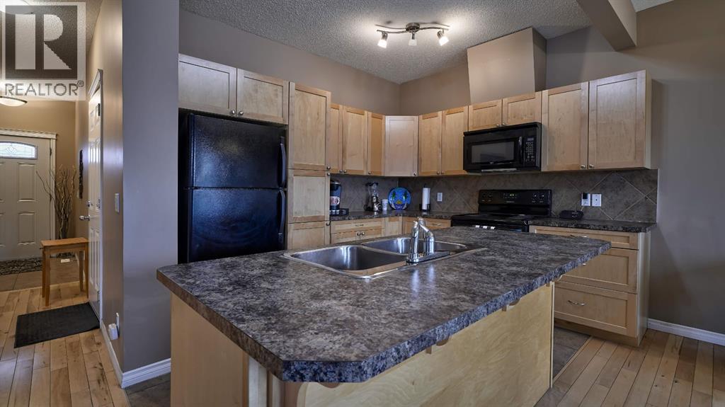 805, 620 Luxstone Landing SW, Airdrie, Alberta  T4B 0B6 - Photo 6 - A2300918