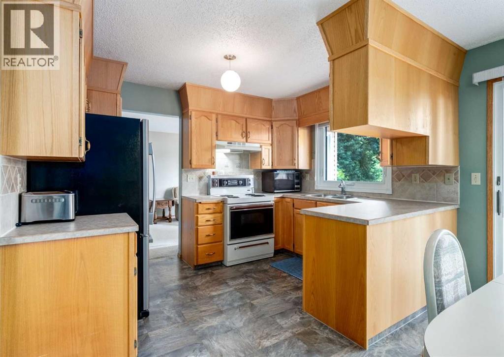 7919 Silver Springs Road NW, Calgary, Alberta  T3B 4K4 - Photo 7 - A2333967
