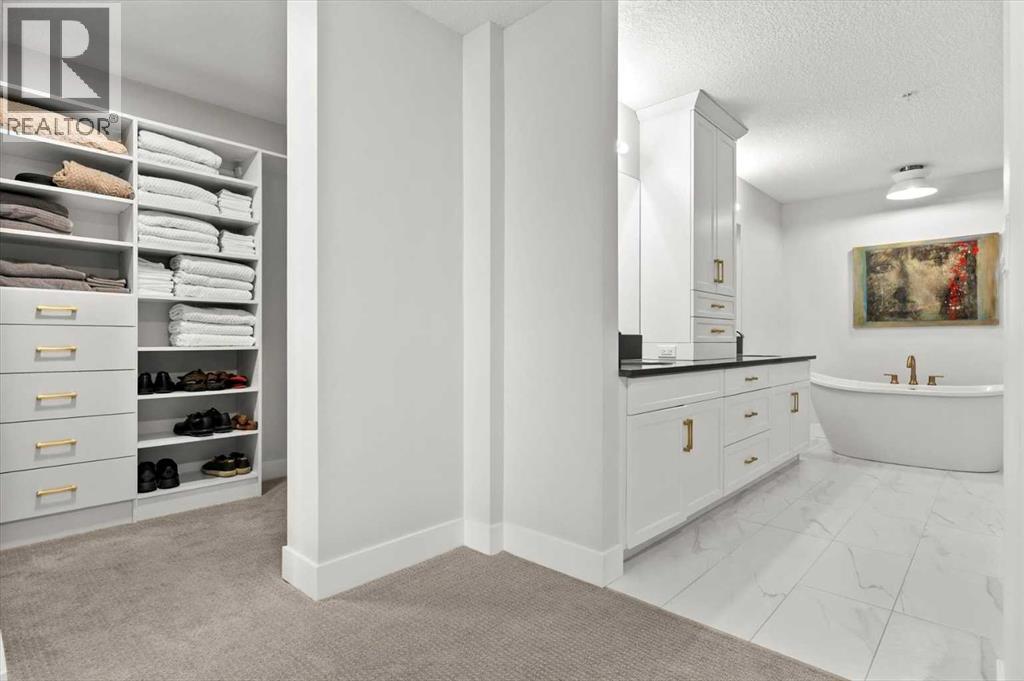 209, 15 Cougar Ridge Landing SW, Calgary, Alberta  T3H 6C3 - Photo 25 - A2317526