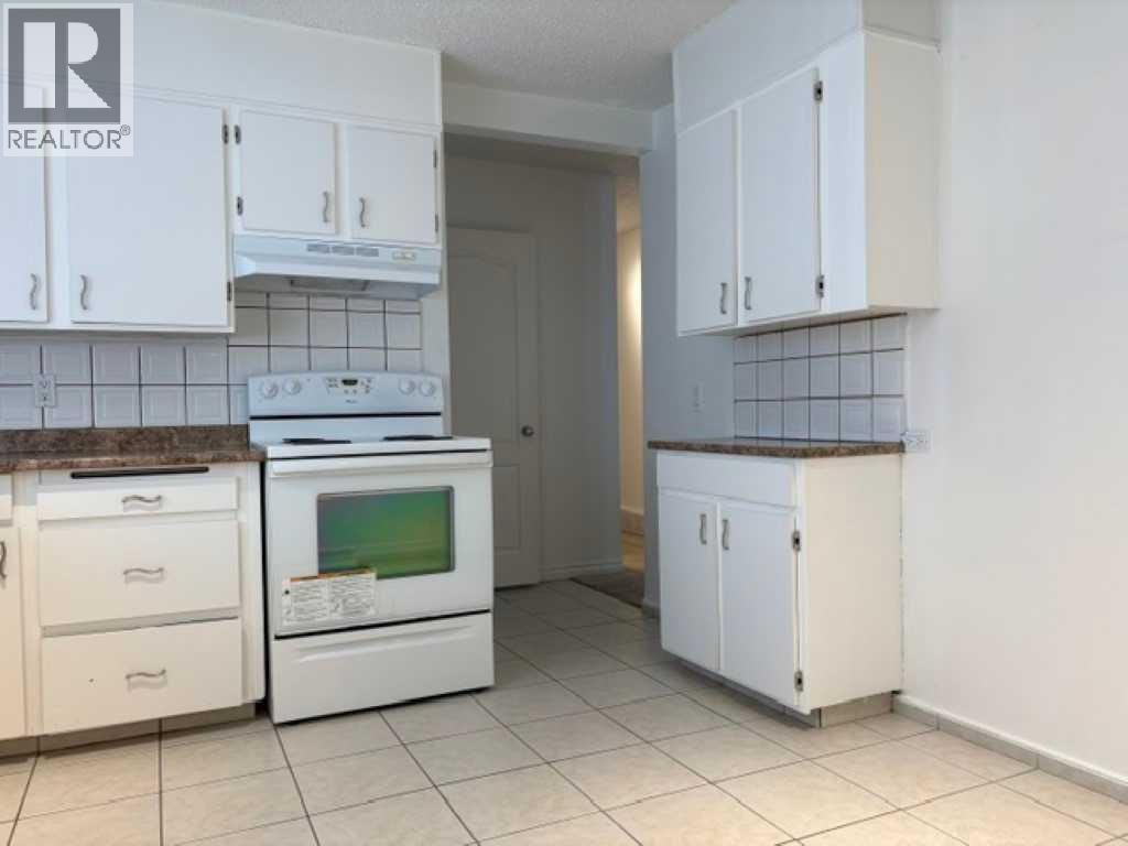 715 64 Avenue NW, Calgary, Alberta  T2K 0M3 - Photo 7 - A2332748
