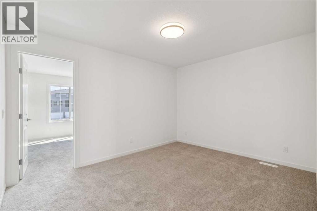 37 Bluerock Hill SW, Calgary, Alberta  T2Y 0V8 - Photo 19 - A2332885