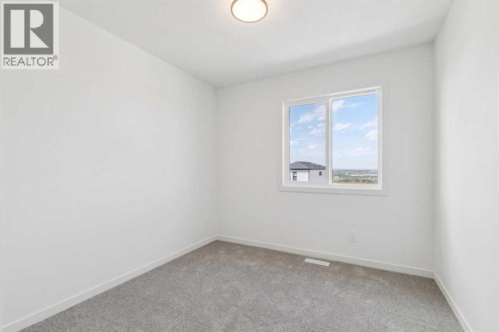 37 Bluerock Hill SW, Calgary, Alberta  T2Y 0V8 - Photo 16 - A2332885