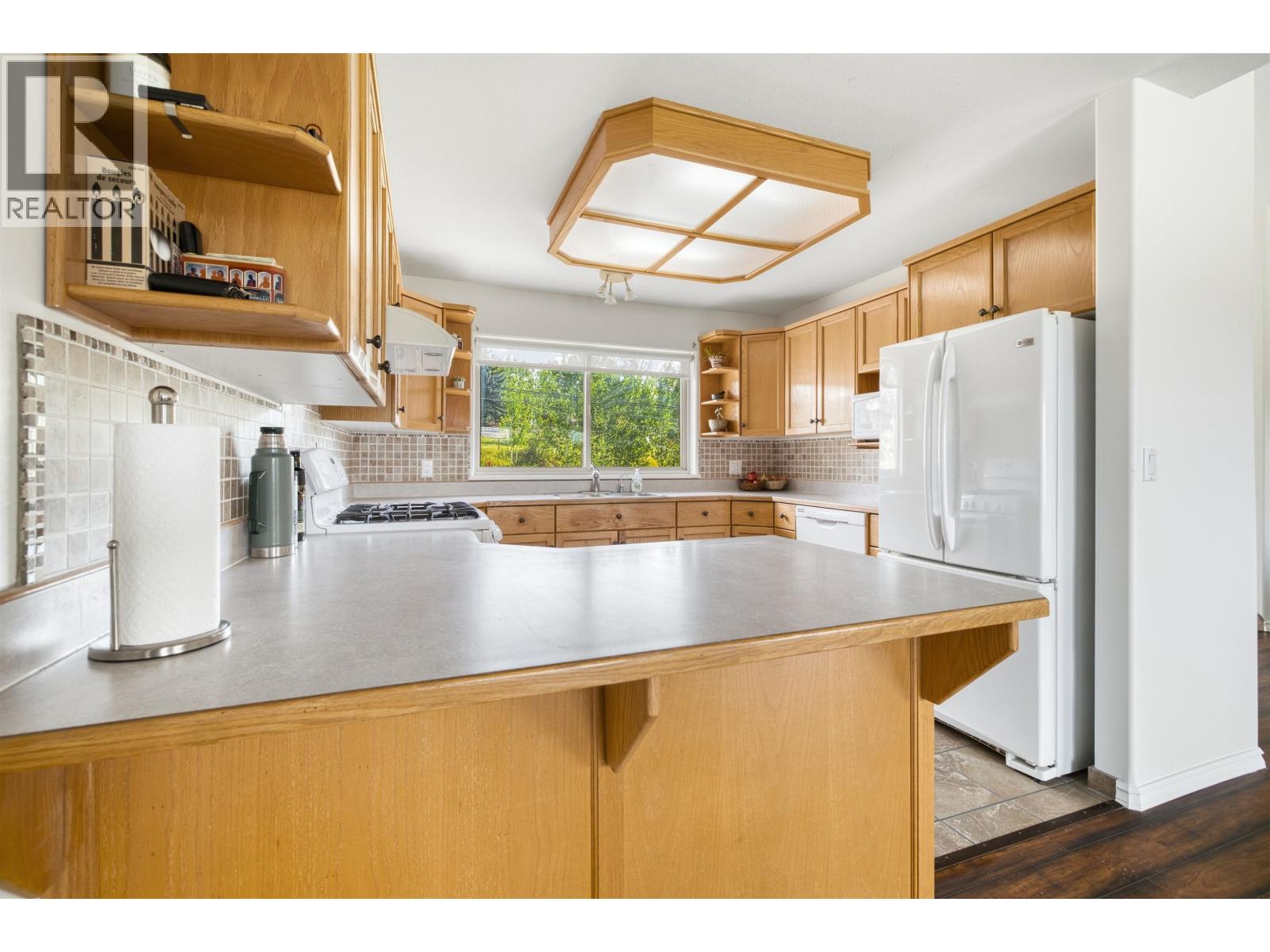 4904 Telqua Drive, 108 Mile Ranch, British Columbia  V0K 2Z0 - Photo 12 - R3153167