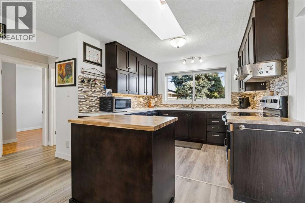 5635 Travis Crescent NE, Calgary, Alberta  T2K 3W1 - Photo 9 - A2335001