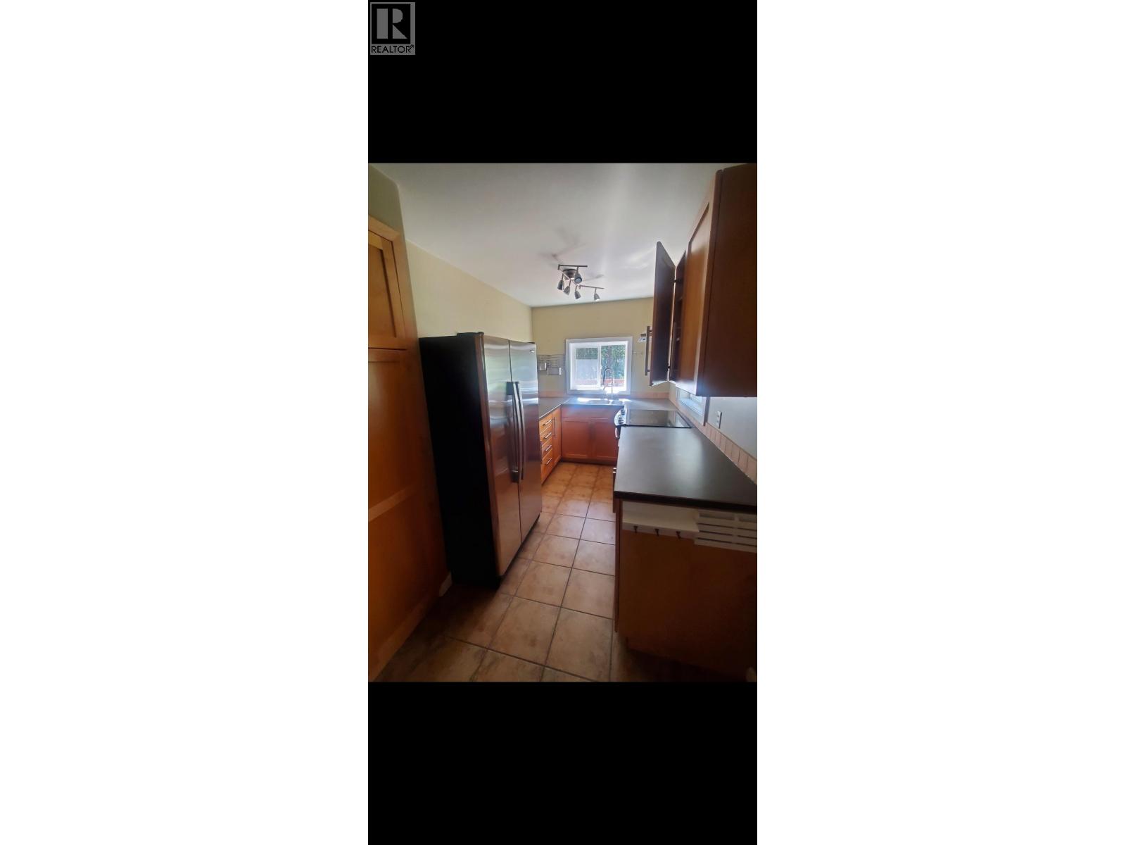4907 Gloinnzun Drive, 108 Mile Ranch, British Columbia  V0K 2Z0 - Photo 4 - R3153110