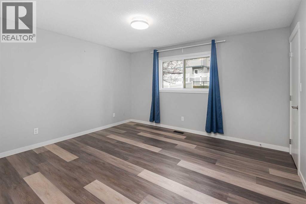 51 Woodmont Road SW, Calgary, Alberta  T2W 4L6 - Photo 24 - A2324229