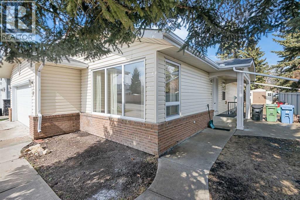 51 Woodmont Road SW, Calgary, Alberta  T2W 4L6 - Photo 2 - A2324229