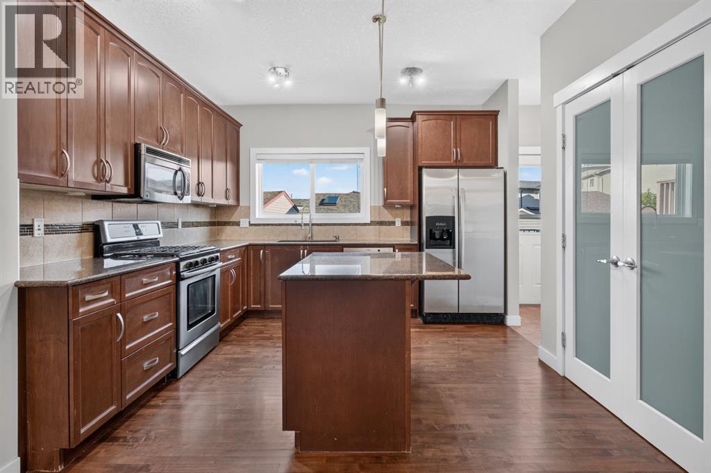 22 Panora Road NW, Calgary, Alberta  T3K 0R4 - Photo 12 - A2334301