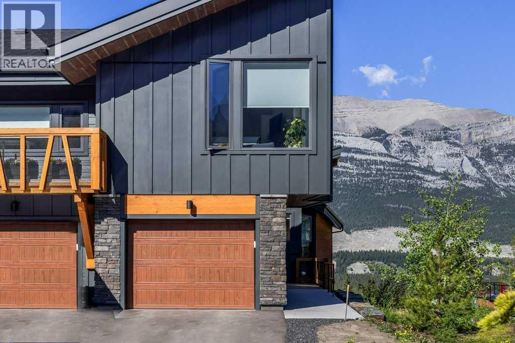 202m, 209 Stewart Creek Rise, Canmore, Alberta  T1W 0N9 - Photo 2 - A2327279